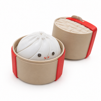Cute white 3D printed dumpling inside a tan case with a red ribbon